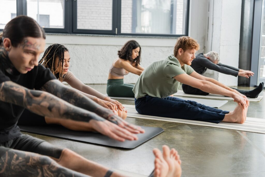 A diverse group practicing stretching together